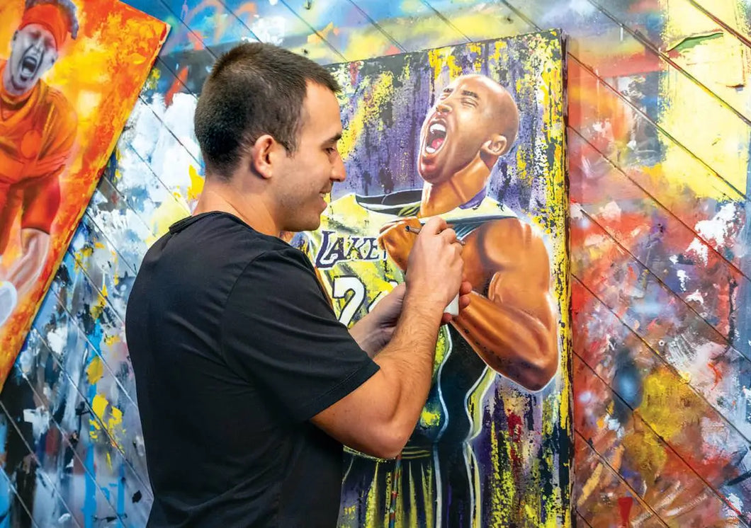 Rios Studios painting Kobe Bryant shouting on canvas with airbrush